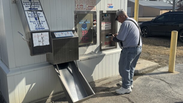 Leroy Davidson pays for his water at a kiosk in Pittsburg, Kan., on Feb. 10, 2026. It was not among those tested in the University of Iowa research. He said he gets water from the kiosk about twice a month.