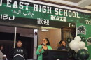 Superintendent Jennifer Collier celebrates East High School's centennial anniversary with a crowd of student, alumni and staff.
