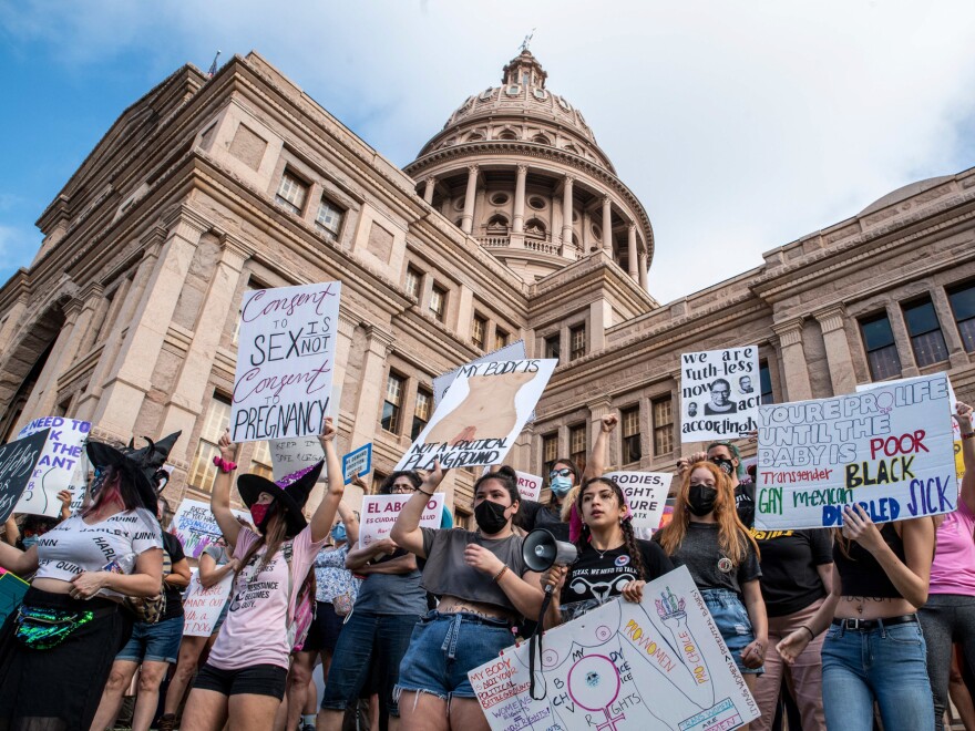 Protesters take part in the Women's March and Rally for Abortion Justice at the State Capitol in Austin, Texas, on October 2, 2021. - The abortion rights battle took to the streets across the US, with hundreds of demonstrations planned as part of a new "Women's March" aimed at countering an unprecedented conservative offensive to restrict the termination of pregnancies. (Photo by Sergio FLORES / AFP) (Photo by SERGIO FLORES/AFP via Getty Images)