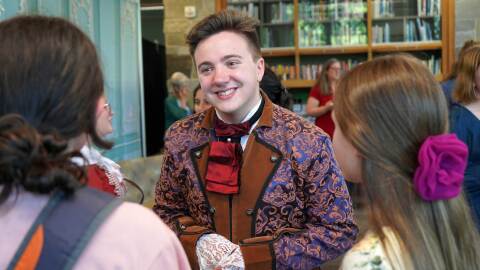 Jackson Hooper performs during an immersive theatrical murder mystery at the Soldotna Public Library in Soldotna, Alaska, on Wednesday, July 29, 2026.