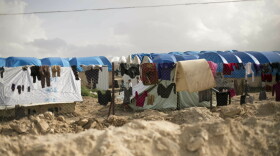 Laundry dries on a chain link fence at al-Hol camp in Syria on March 31, 2019. (Maya Alleruzzo/AP/File)