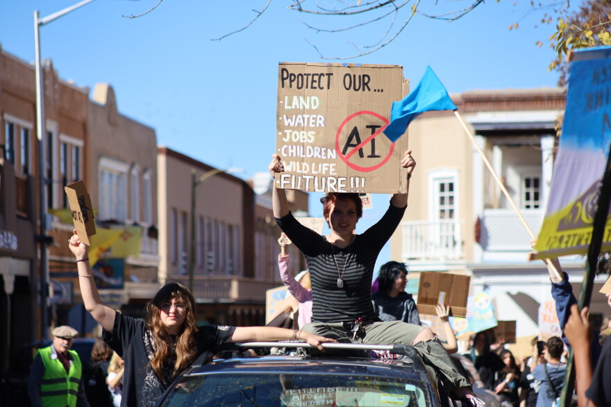 Students from the New Mexico School for the Arts in Santa Fe marched to the Capitol for the “Pull Out the Plug” protest on Oct. 27, 2026.