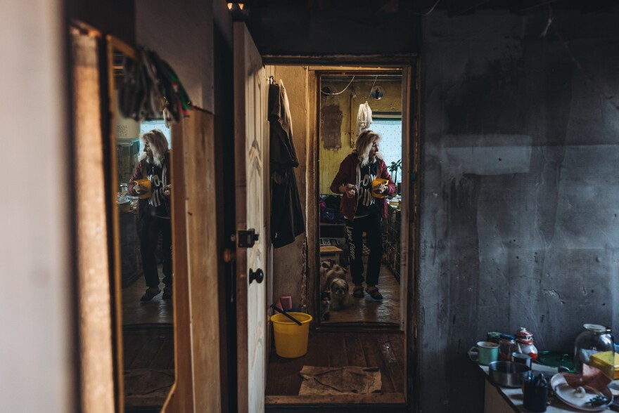 <strong>March 25:</strong> Svietla prepares food before returning to the basement where they live in northern Kyiv, Ukraine.