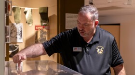 Texas Heritage Museum Director John Versluis points out a gun on display during a museum tour on March 2, 2026.