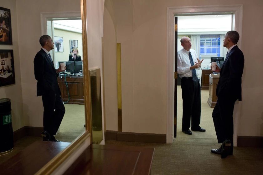 President Barack Obama chats with Neil Eggleston, counsel to the president, outside his office in 2014.