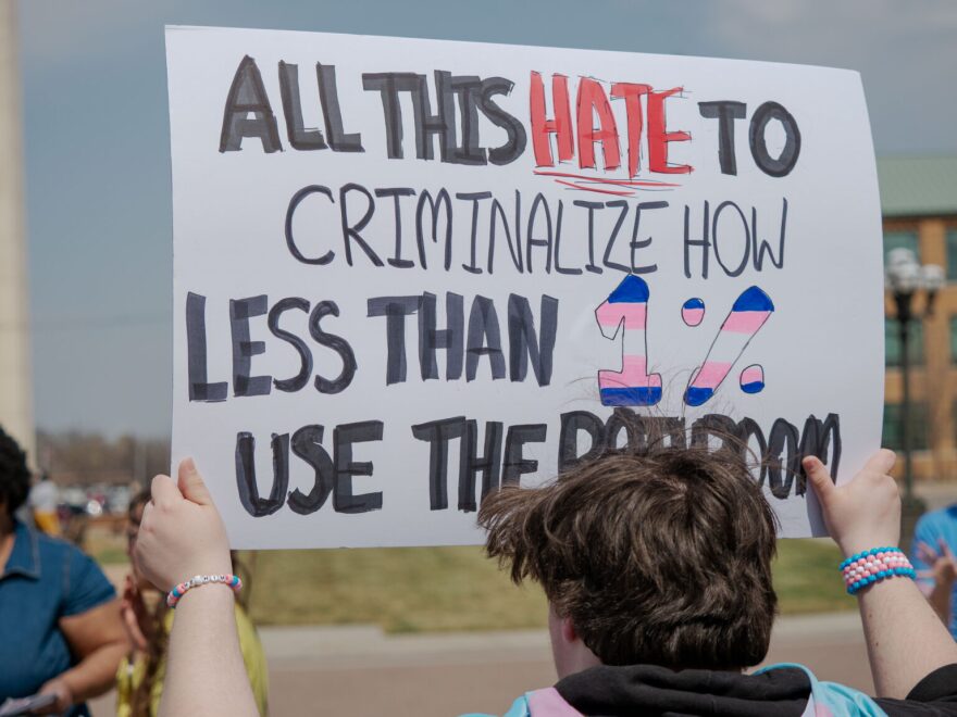 Connor Montgomery, of Manhattan, holds a sign as part of a Trans Day of Visibility demonstration March 31, 2026, outside the Kansas Statehouse.