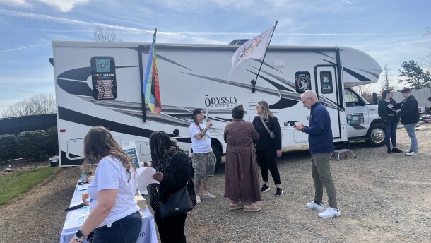 About a dozen people waited today to enter a 32-foot RV parked in Charlotte that aims to help LGBTQ+ and other underserved community members affirm their identities through official documentation.