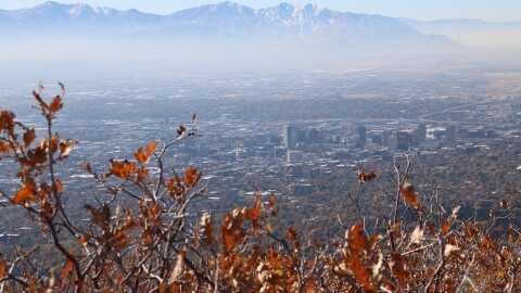 A view of the Salt Lake Valley with a visible layer of pollution in the air.