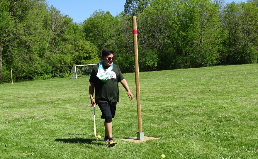 Traditional lacrosse stick maker Sapatis Menomin checks the field before the games begin.