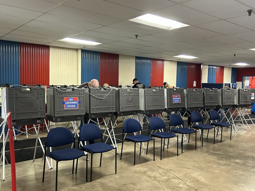 Voters line up at booths to cast their ballots on Primary Election Day, Aug. 11, 2026, at the Chisholm Sports Arena complex.