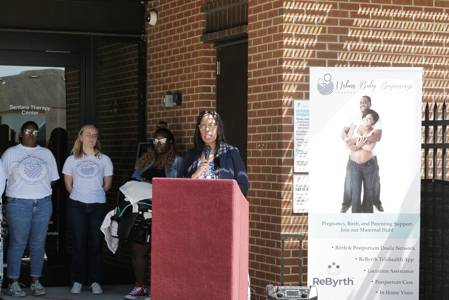 Stephanie Spencer, founder of Urban Baby Beginnings, calls for transparency in the state’s perinatal health hub program on April 11.