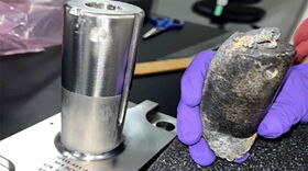 On the right is the burnt piece of space debris that crash into a home in Naples. A NASA technician is holding it up against what the same piece looks like when new on the left. The space debris was part of flight support equipment that NASA used to mount International Space Station batteries on a cargo pallet.