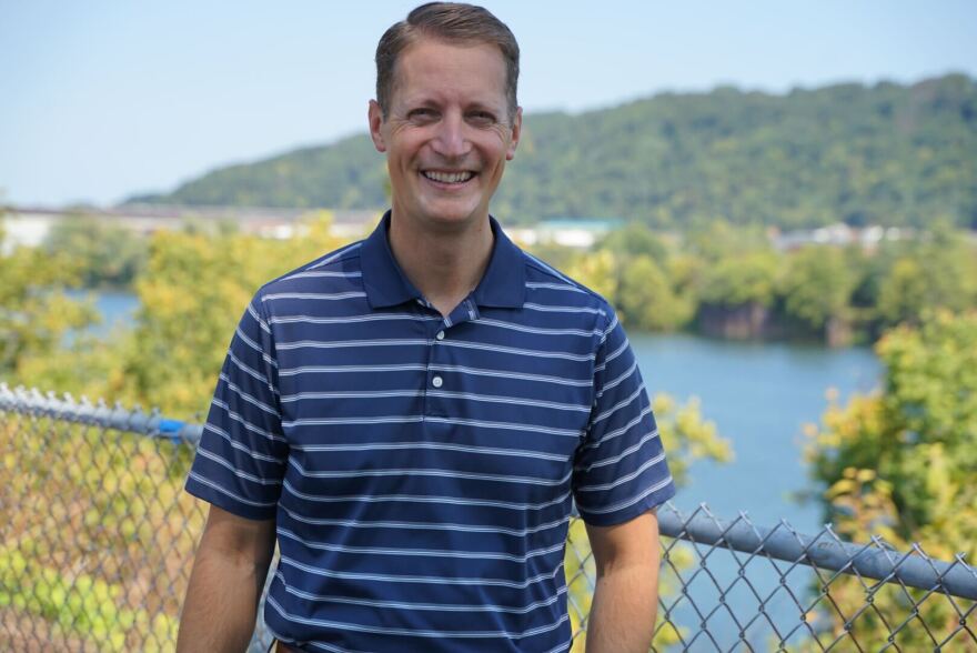 Rob Mercuri poses in front of the Ohio River just before heading to the grand opening of a new library in Pine Township where he lives with his family.