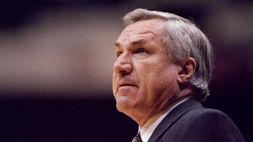 Former University of North Carolina head basketball coach Dean Smith looks on during the Tar Heels' NCAA Tournament game against the Texas Tech Red Raiders in 1996. Smith died on Saturday. He was 83.