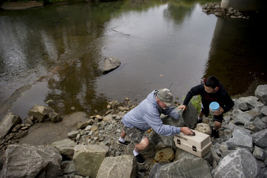 Whedbee fishes for trout with his grandson, Mason, in Two Lick Creek in Homer City, Pa.