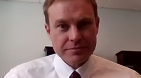 Aaron Frey headshot in his office