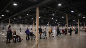 Long lines mostly comprising seniors and their caretakers during the first day of the mega vaccine center at Fair Park in Dallas on Jan. 11. <a href="https://www.keranews.org/texas-news/2021-01-24/doses-are-trickling-in-a-look-at-vaccine-rollouts-in-the-rio-grande-valley-and-dallas">Full Story</a>