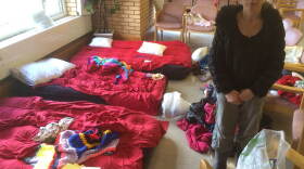 Priscilla Smithers and her four children have arranged chairs around a few air mattresses to create a space for themselves, after fleeing their home.