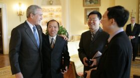 Wang Yi (second from right) and other human rights activists from China meet with former President George W. Bush at the White House in 2006. Wang Yi was arrested in December 2018 by Chinese authorities and now has been sentenced to nine years in prison.