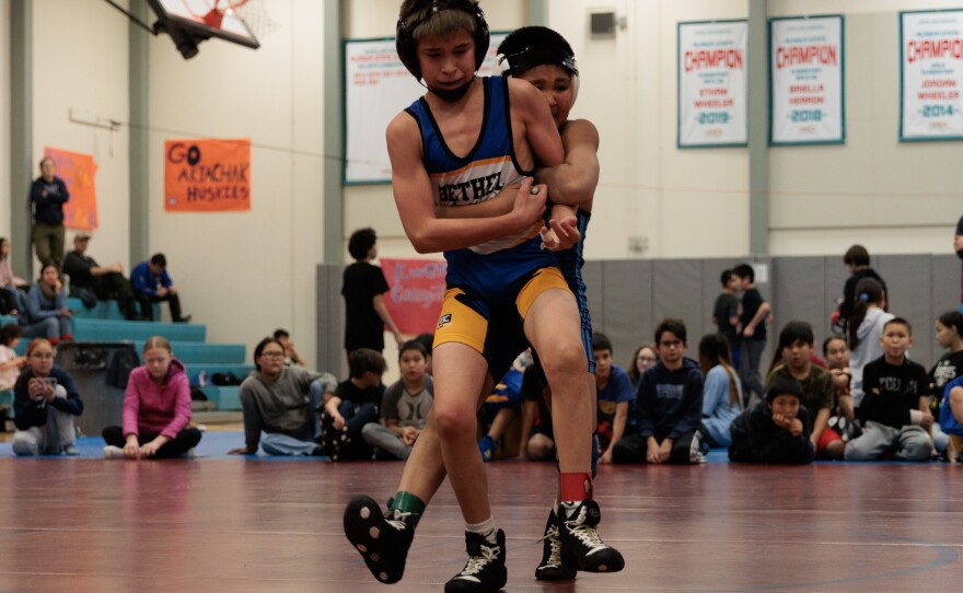Bethel Junior High wrestler Cole Iverson defending against a takedown attempt.