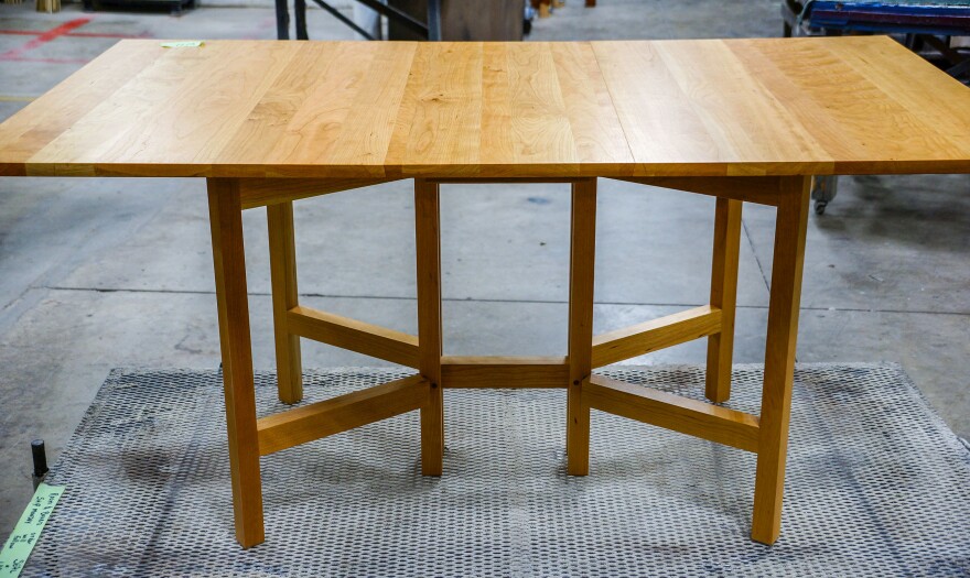 A finished gate-leg cherry table, ready to ship.