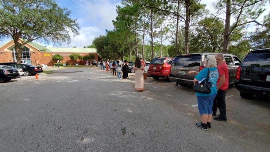 Voters line up on Oct. 19 to cast their ballots at the Southeast Regional Branch of the Jacksonville Public Library.