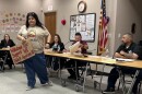 Estela Juarez presents a petition to the Orange Cove City Council during an April 22 meeting signed by 652 residents objecting to the city’s participation in a hydrogen blending project planned by the Southern California Gas Co.