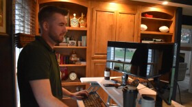 Joey Klaus, a field operations manager for electric vehicle manufacturer Tesla, works remotely from his Morton home.