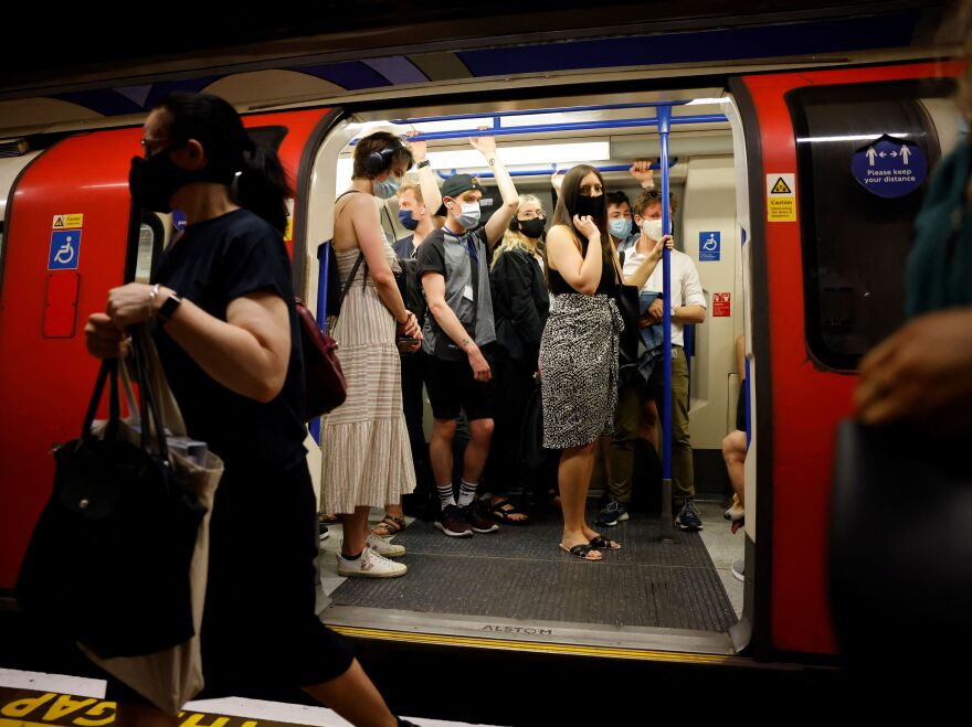 Commuters on the London Underground continued to wear masks on Monday, as required by the transport service.