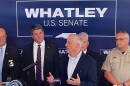 GOP U.S. Senate candidate Michael Whatley speaks at a podium in Harrisburg.