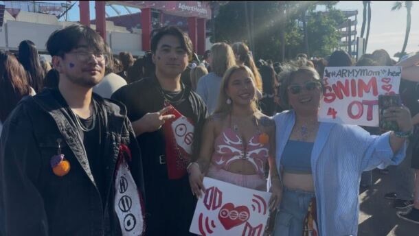BTS fans pose in a crowd before the BTS concert at the Raymond James Stadium. 