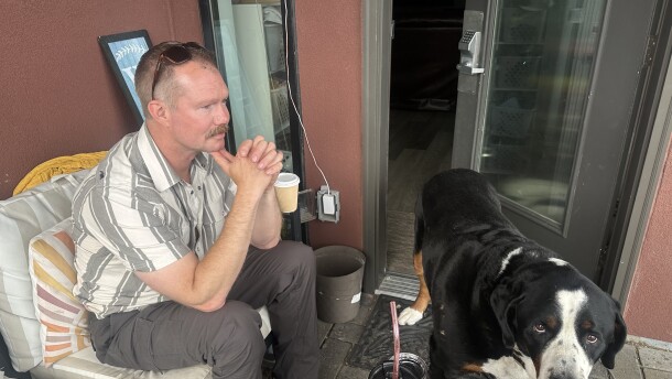 Aspen Fire Chief Jake Andersen takes a break on his back porch near the Aspen Airport Business Center on July 9, 2026. His dog, affectionately named “Tug Boat,” keeps him company.