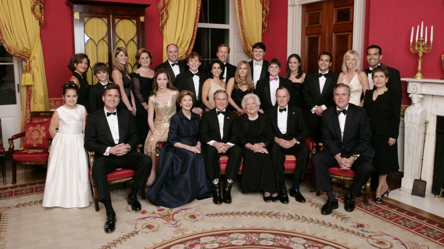 Then-President George W. Bush, then-first lady Laura Bush, former first lady Barbara Bush and former President George H.W. Bush sit surrounded by family in the Red Room of the White House on Jan. 6, 2005, in Washington, D.C. Friends and family joined former President Bush and Barbara Bush in celebrating their 60th wedding anniversary at a dinner.