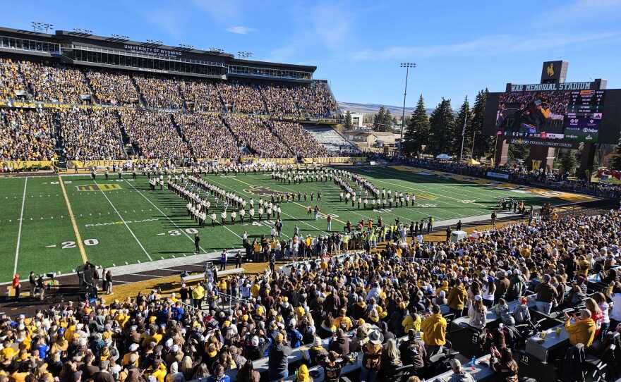 The Western Thunder Marching Band forms the number 17 in front of a packed stadium.