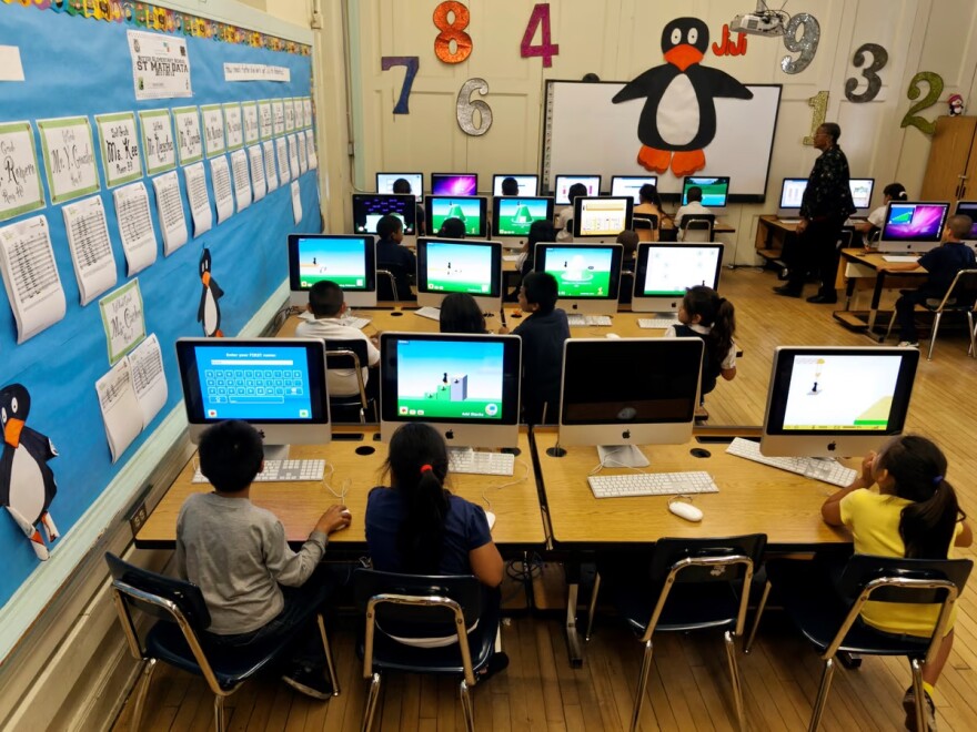 In this May 15, 2012 file photo, Ritter Elementary School elementary students practice their math skills in Los Angeles.