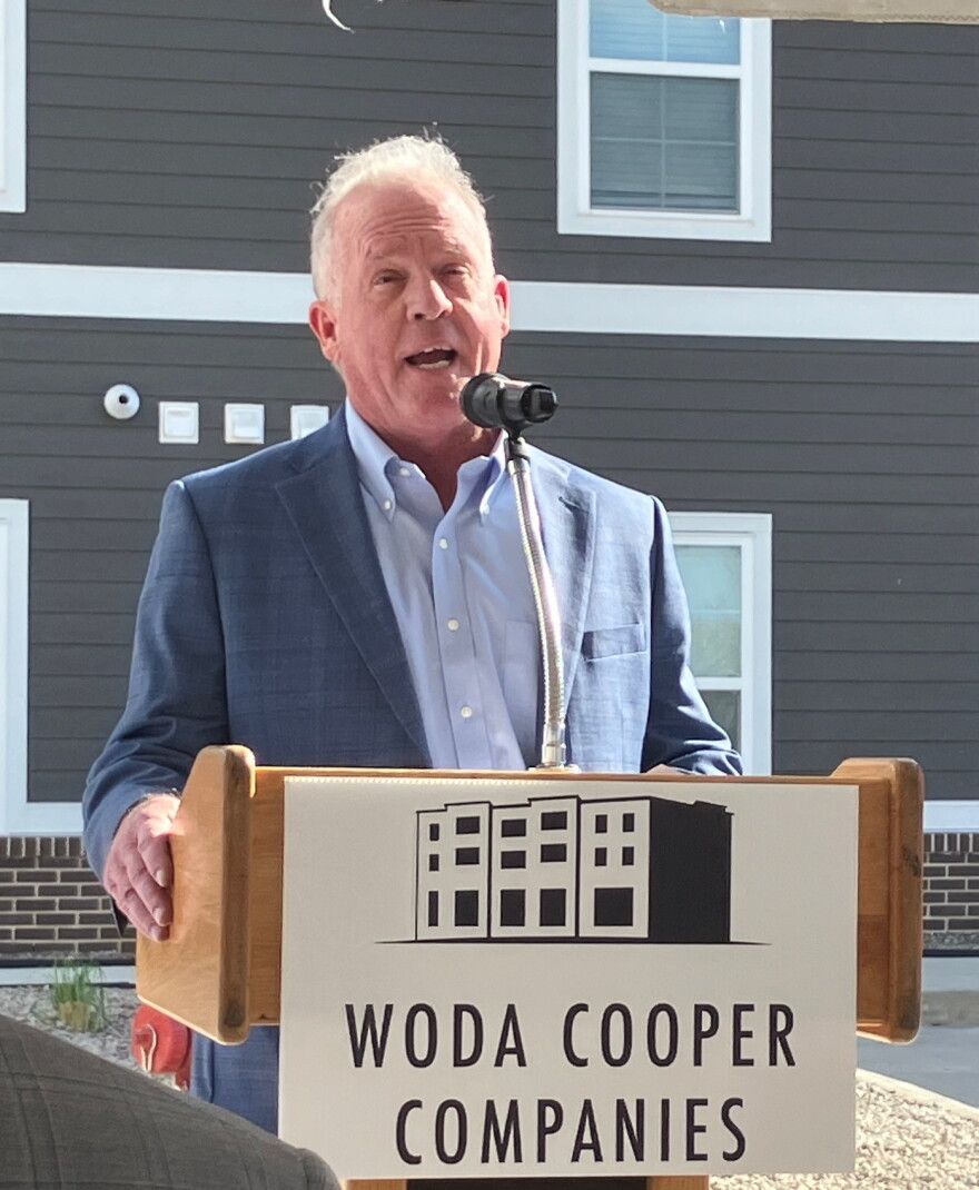 Barry Accountius, Woda Cooper vice president for development, speaks before the Wednesday ribbon-cutting at Timber Ridge.