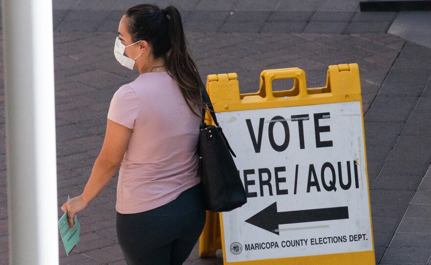 A voter waits to cast their ballot during Arizona's primary election on Aug. 4 in Phoenix.