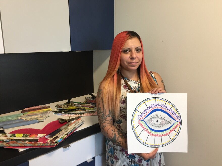 Lisa Ortiz says the Women's Recovery Center has helped her with art therapy. She enjoys drawing eyes since it makes her reflect on her life.