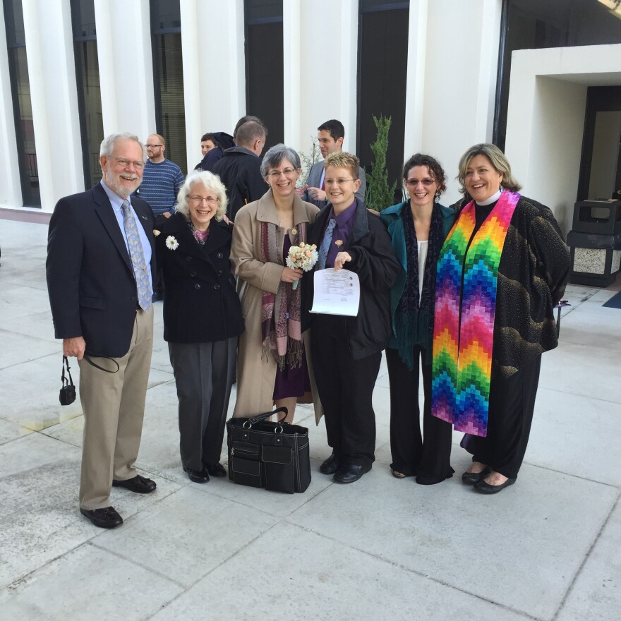 Rebecca and Marcy MacDonell (center) with their wedding party.