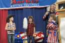 A Luzerne County boy took top honors Monday in a mullet contest at the Pennsylvania Farm Show in Harrisburg. Drew Fleschut, 10, of Dallas, in the middle, wore a red-and-black shirt in an homage to movie character Joe Dirt and carried Joe’s trademark mop.