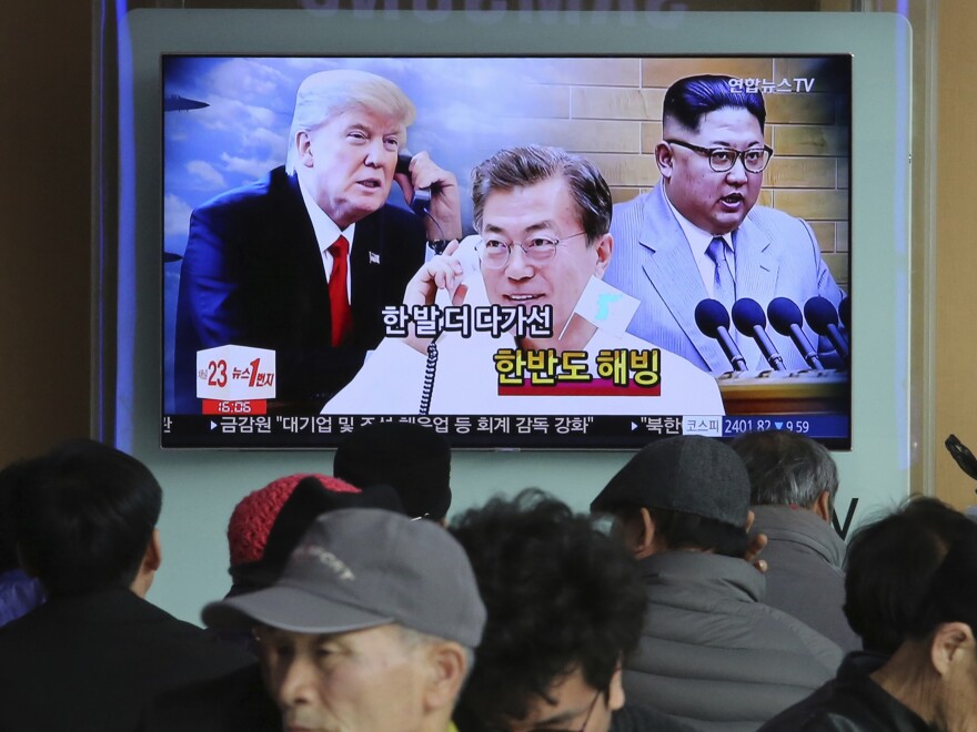People watch a TV screen showing images of North Korean leader Kim Jong Un, right, South Korean President Moon Jae-in, center, and President Trump at the Seoul Railway Station in Seoul, South Korea, last month.