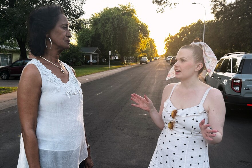 Sandra Kennedy, left, and Casey Clowes, candidates for the Salt River Project governor board, speak while canvassing in Tempe, Ariz., on Wednesday, April 1, 2026.