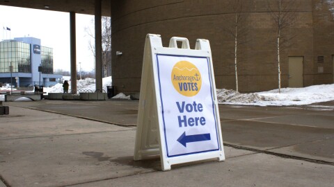 A sign saying vote here outside of Z.J. Loussac Library in Anchorage.