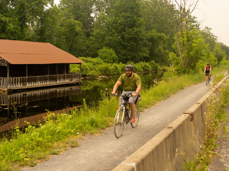 Bikers arrive in Camillus along the Erie Canal. 