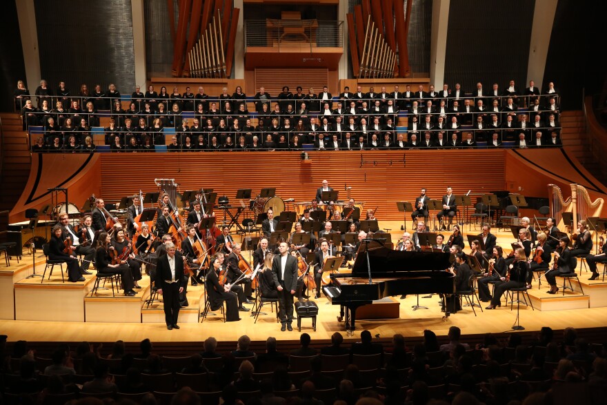 Michael Stern, pianist Eldar Nebuldsin and members of the Kansas City Symphony and Chorus take a bow after an April 2018 performance of Beethoven's "Choral Fantasy."