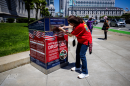 Monica Holguin places her ballot at a drop box outside City Hall in San Francisco on May 15, 2026. NPR member stations across California have been tracking these changes to the state’s congressional map, the candidates and the issues in their communities.