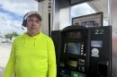 A trucker stands in front of a pump at Tampa Truck Stop off of U.S. 301. 