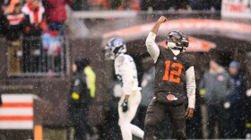 Cleveland Browns quarterback Shedeur Sanders celebrates after throwing a touchdown pass in the first half of an NFL football game against the Tennessee Titans in Cleveland, Sunday, Dec. 7, 2025.  