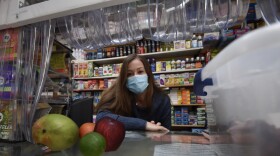 Marta Montoya, co-owner of the La Luna Tienda Latina, behind the register.