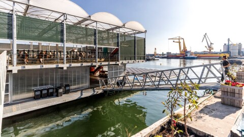 This floating dairy farm, located in Rotterdam's port, was developed by Peter van Wingerden after seeing New York City's food supply chain shatter after Hurricane Sandy. The goal is to develop self-sufficient farms floating on water to improve the resiliency of cities globally.